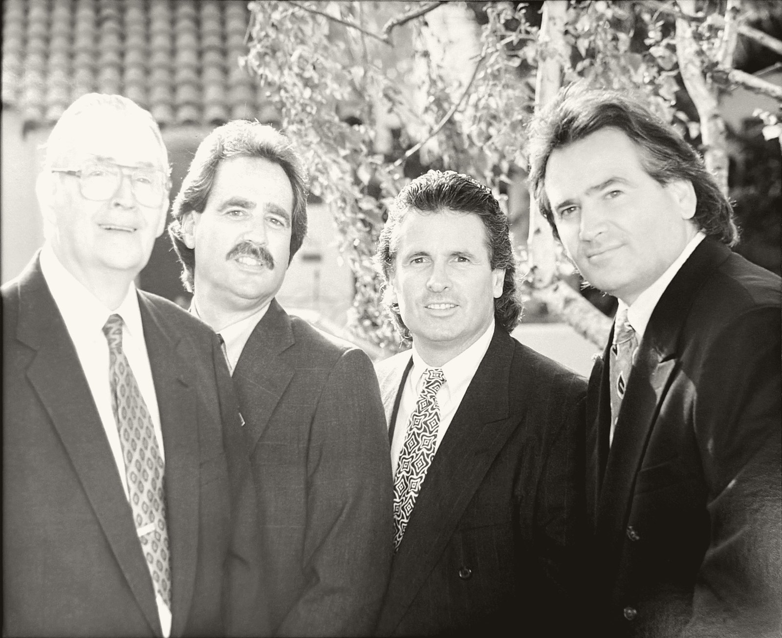 Sam Riddle and his three sons outside the Long Beach yard — the family behind the South Coast Shingle counter