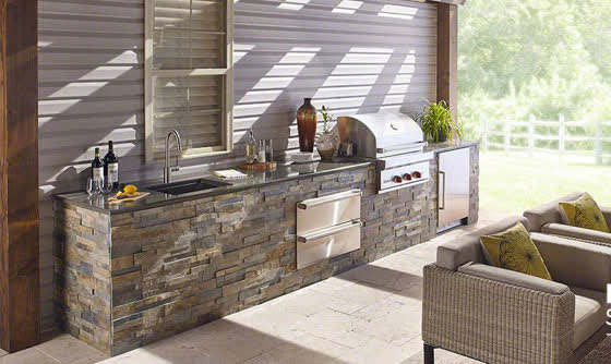 Stacked stone veneer outdoor kitchen